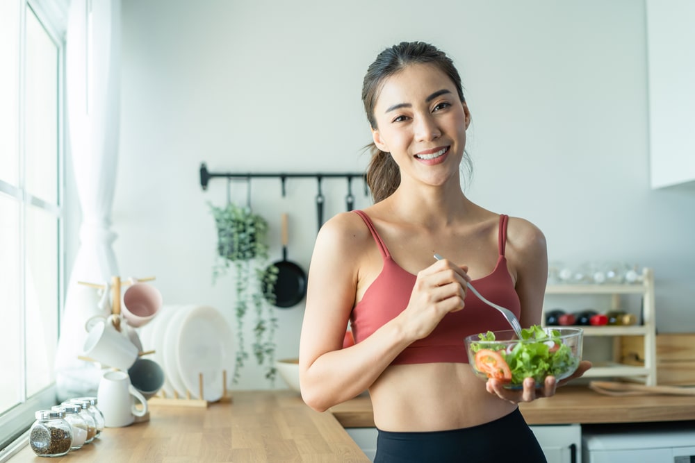 Woman smiling while healthy eating